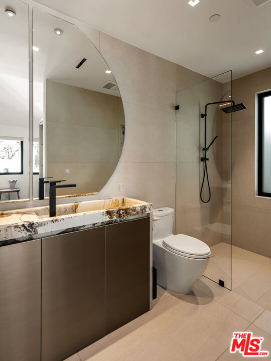 31100 Broad Beach Road Malibu, CA 90265 - Photo 23 of 38 a bathroom with a granite countertop sink toilet and shower