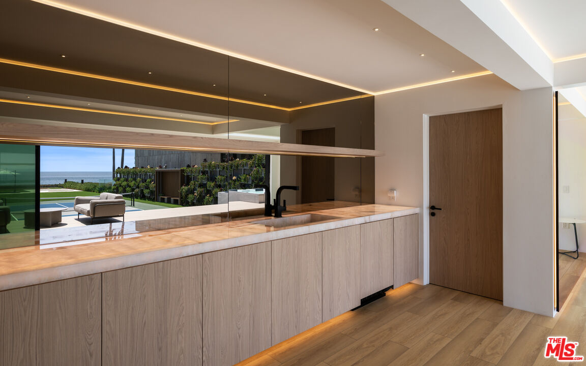 31100 Broad Beach Road Malibu, CA 90265 - Photo 26 of 38 a view of a kitchen with a sink and a large window
