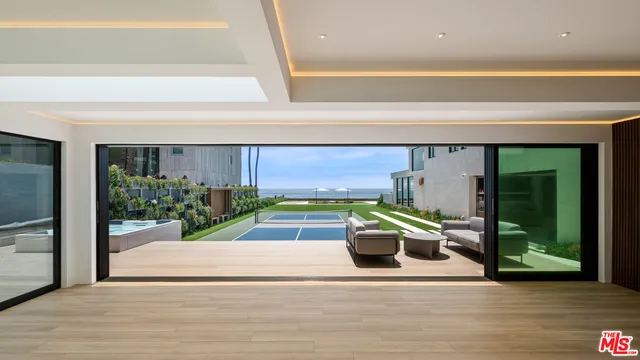 a view of a patio with couches chairs and a fire pit