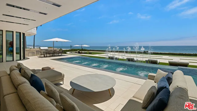a kitchen with a table chairs and a stove
