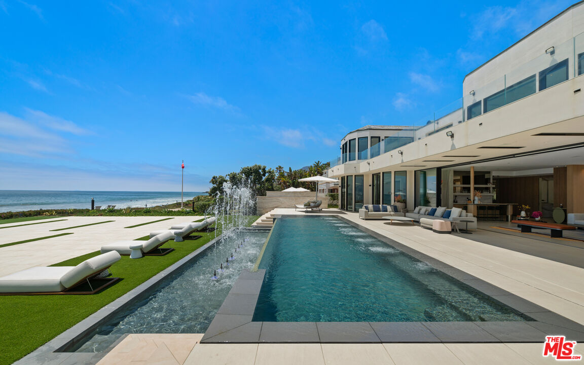31100 Broad Beach Road Malibu, CA 90265 - Photo 36 of 38 a view of a house with swimming pool and sitting area