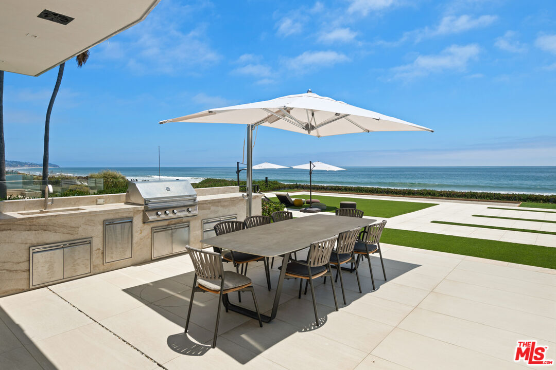 31100 Broad Beach Road Malibu, CA 90265 - Photo 37 of 38 a table and chairs in the patio