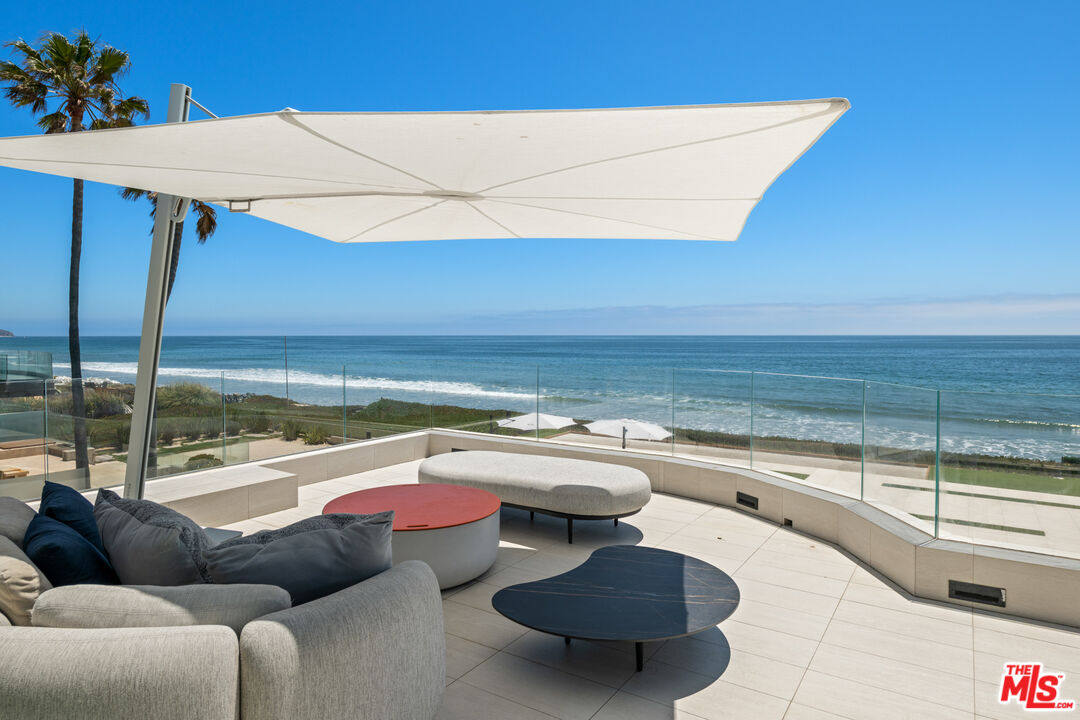 31100 Broad Beach Road Malibu, CA 90265 - Photo 38 of 38 a view of a swimming pool and outdoor seating