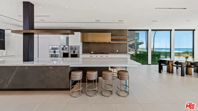 a dining room with furniture a floor to ceiling window and pool table