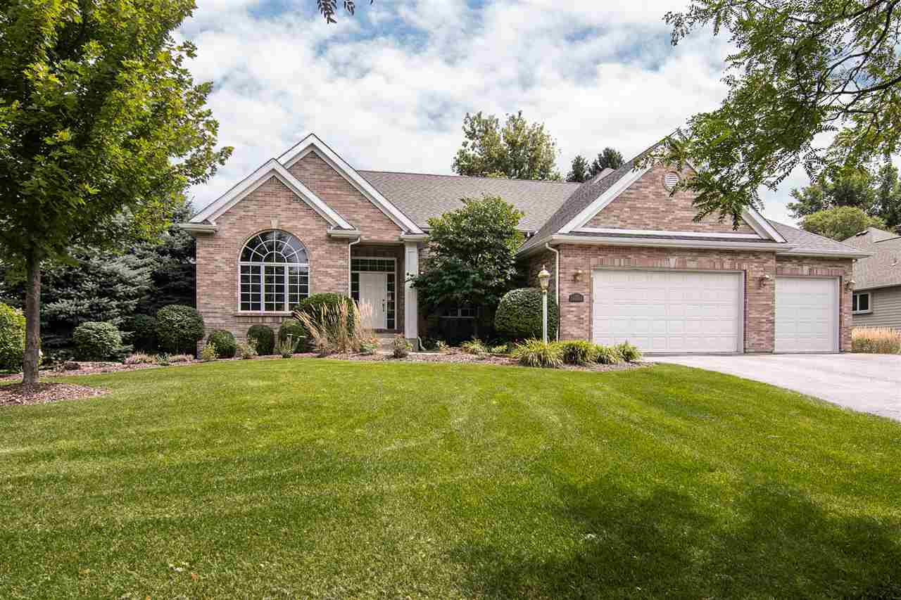 637 Roxbury Road Rockford, IL 61107 - Photo 1 of 25 a front view of a house with a yard and trees