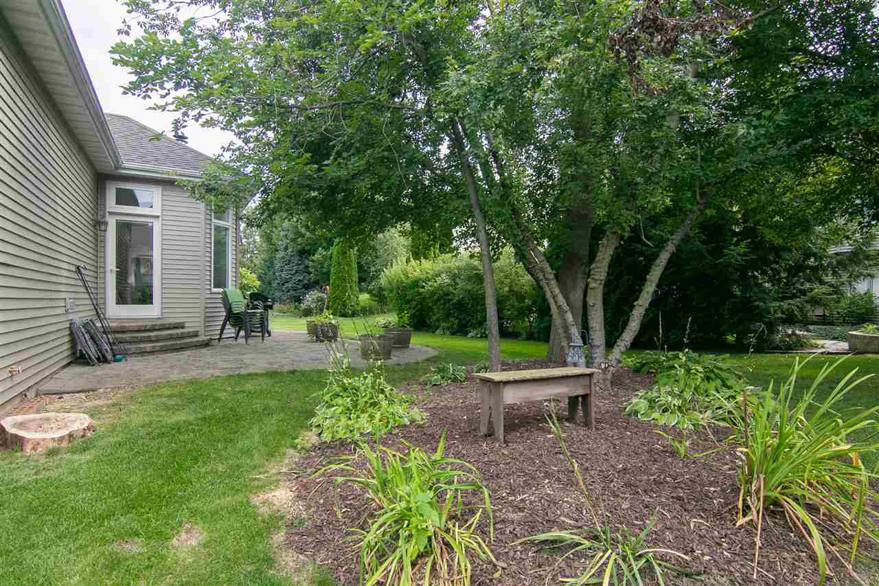 637 Roxbury Road Rockford, IL 61107 - Photo 25 of 25 a view of a chair and table in backyard of the house