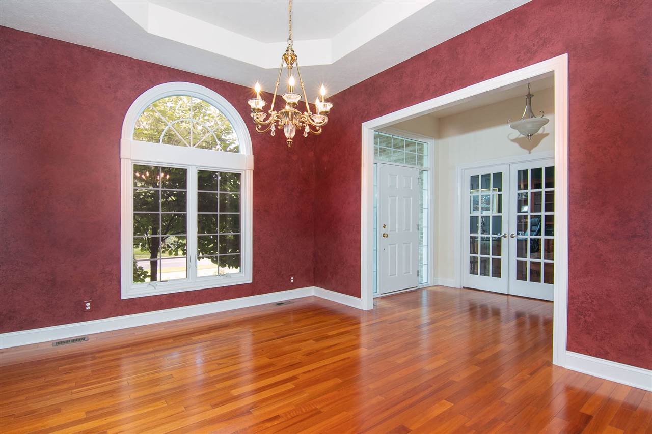 637 Roxbury Road Rockford, IL 61107 - Photo 9 of 25 a view of an empty room with wooden floor and a window
