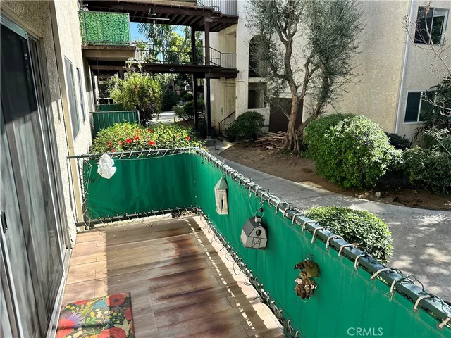 a backyard of a house with outdoor seating