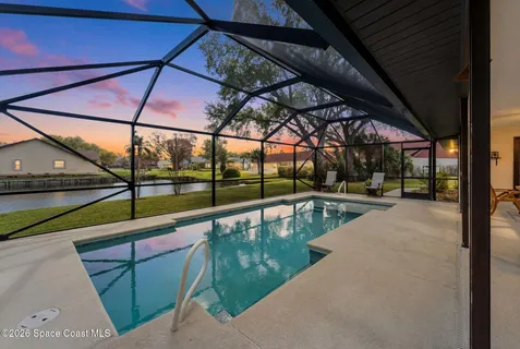 a view of a swimming pool with a patio