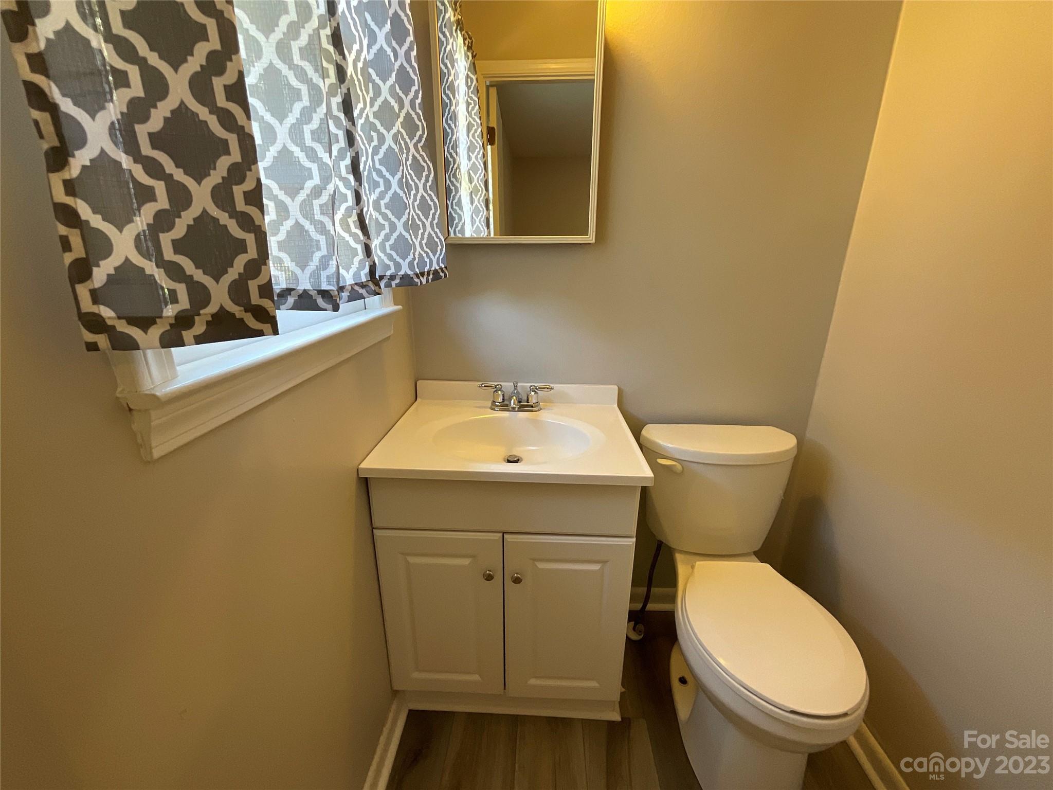 1285 Rainbow Circle Catawba, SC 29704 - Photo 17 of 22 a white toilet sitting next to a bathroom sink