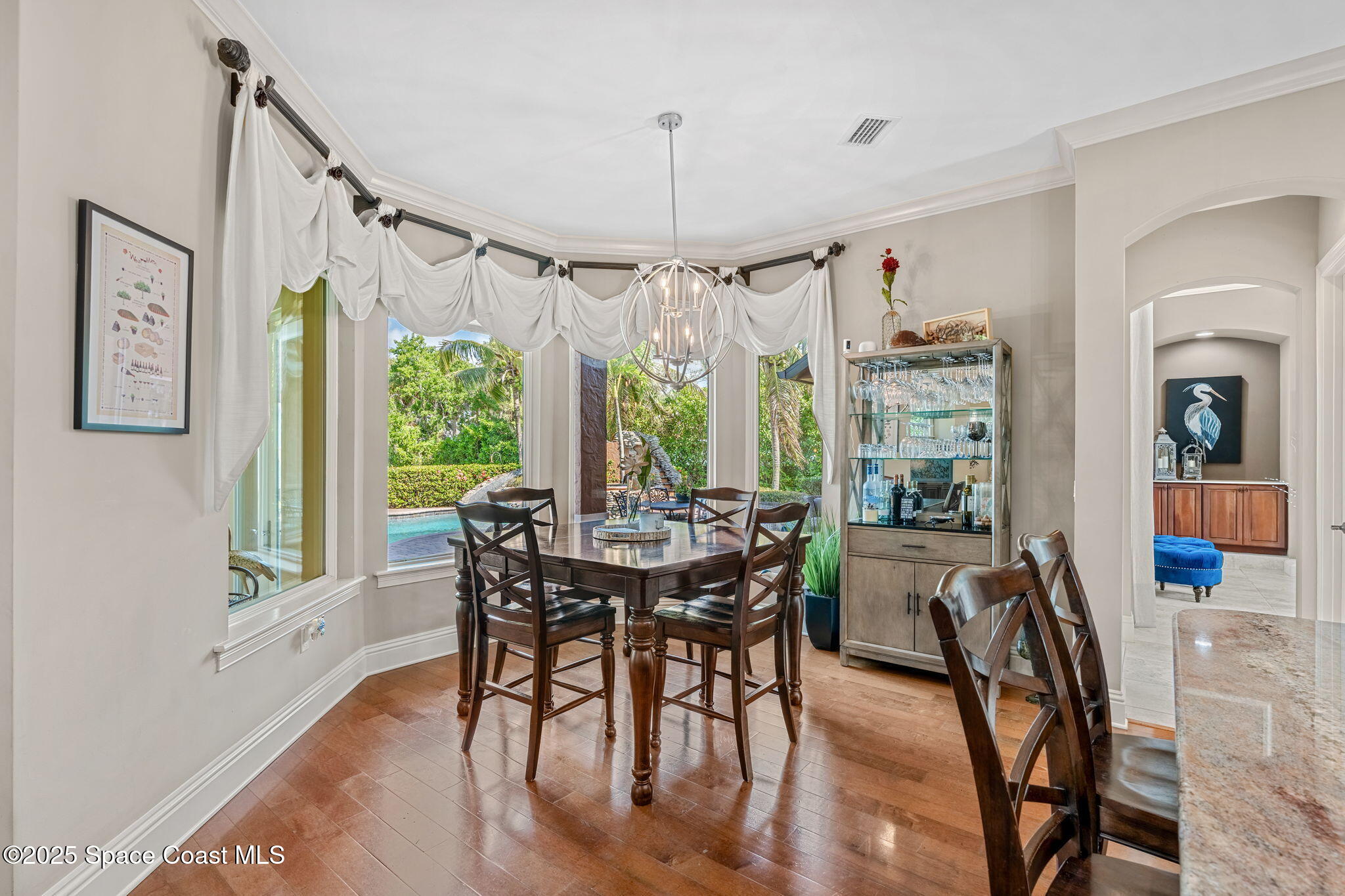 4297 Crooked Mile Road Merritt Island, FL 32952 - Photo 26 of 118 a view of a dining room with furniture window and wooden floor