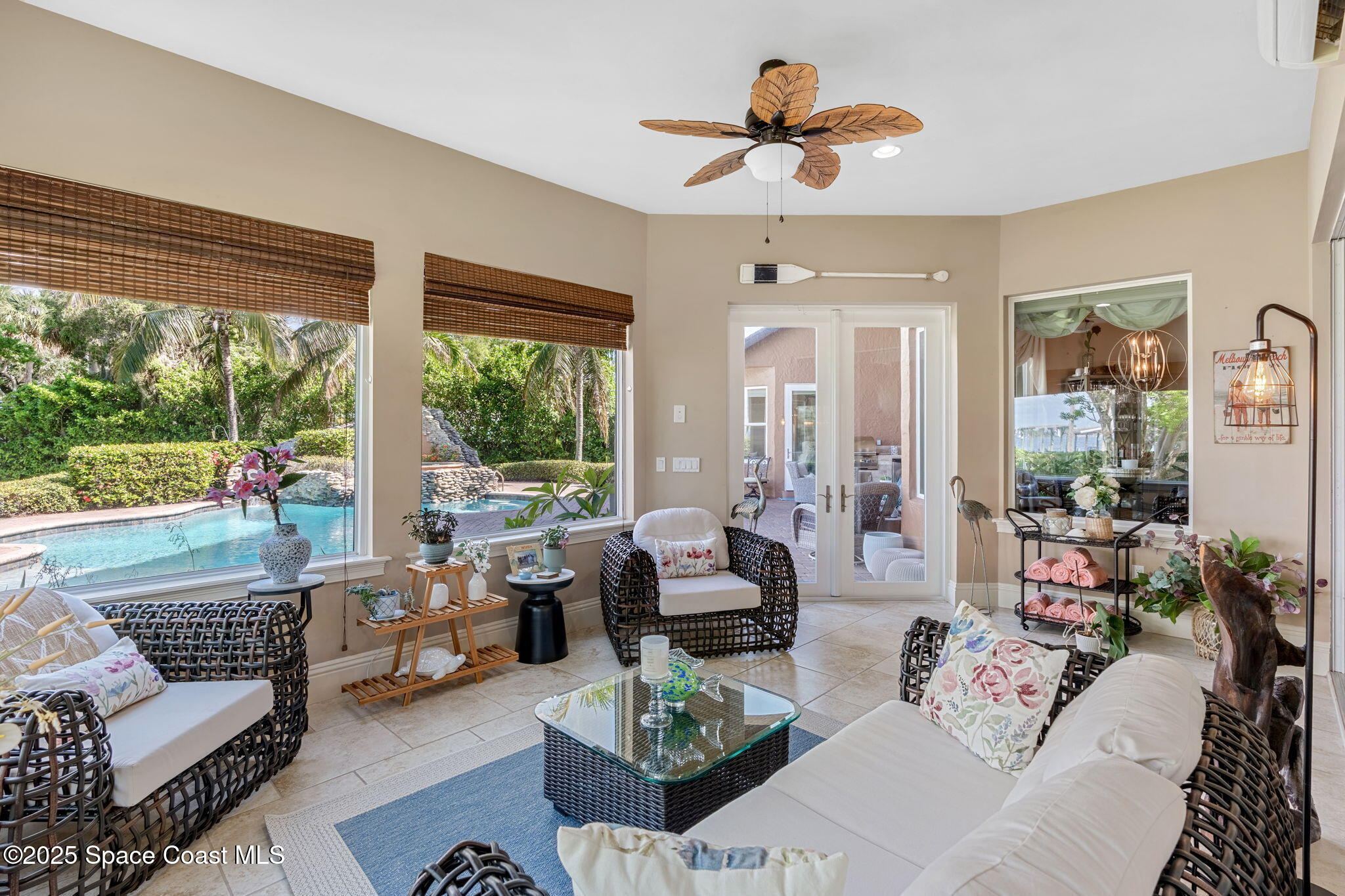 4297 Crooked Mile Road Merritt Island, FL 32952 - Photo 32 of 118 a living room with furniture and a large window