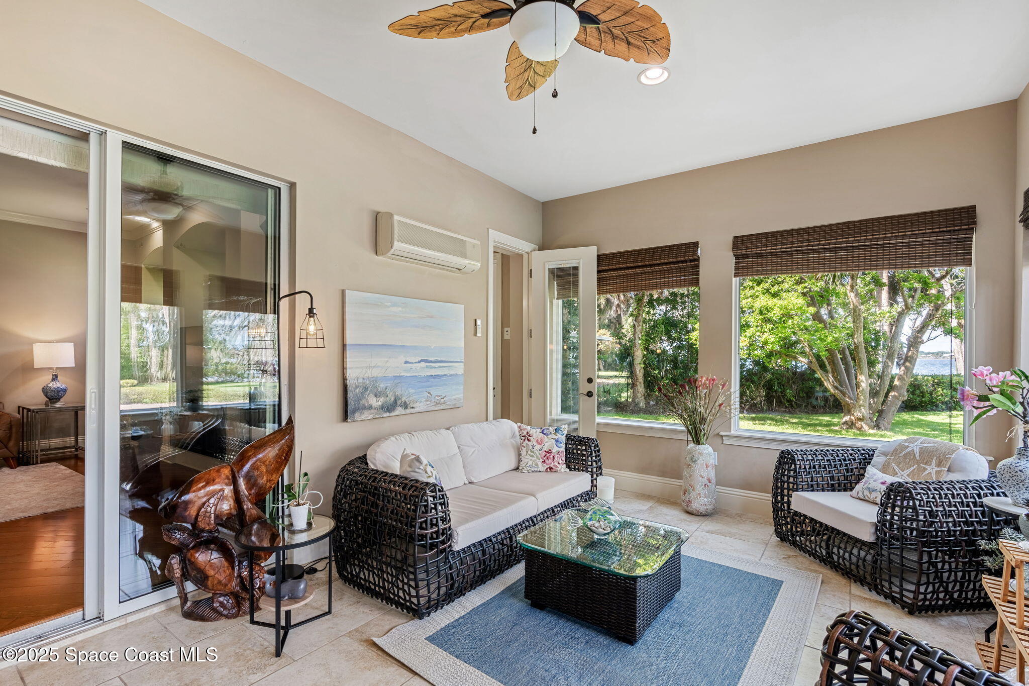 4297 Crooked Mile Road Merritt Island, FL 32952 - Photo 33 of 118 a living room with furniture and a large window