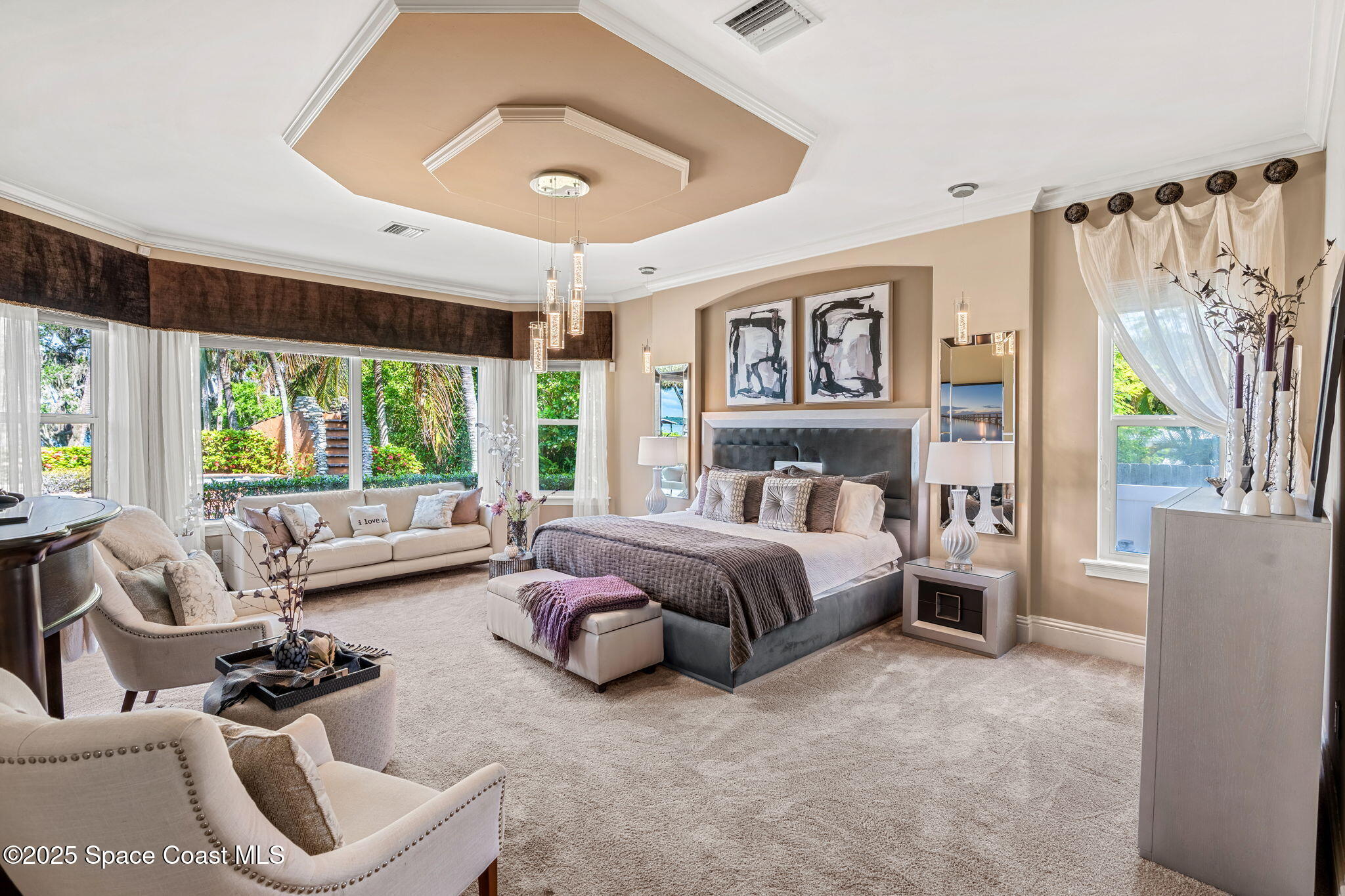 4297 Crooked Mile Road Merritt Island, FL 32952 - Photo 35 of 118 a spacious bedroom with a bed and glass window