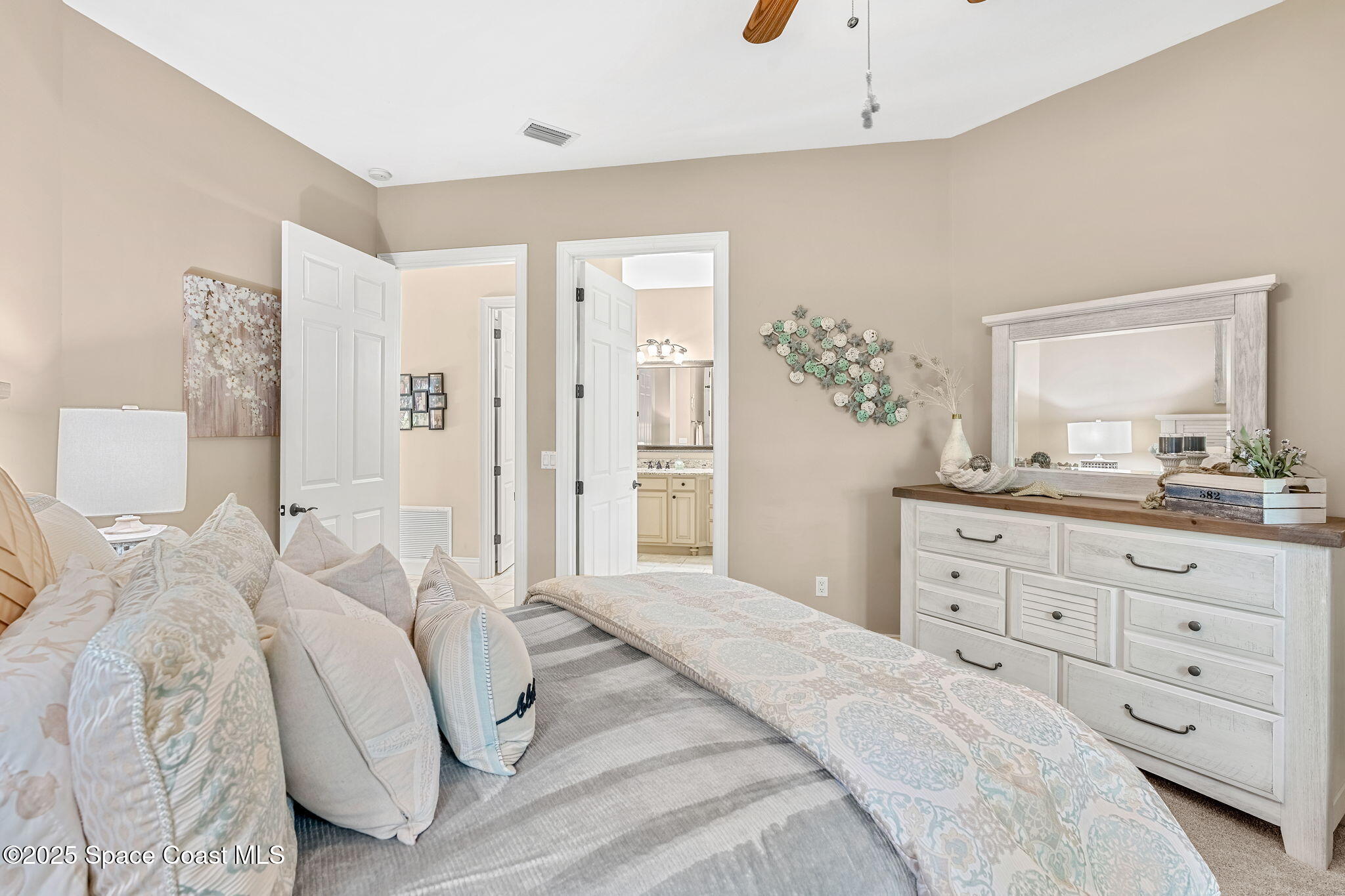 4297 Crooked Mile Road Merritt Island, FL 32952 - Photo 43 of 118 a bedroom with a bed and a dresser