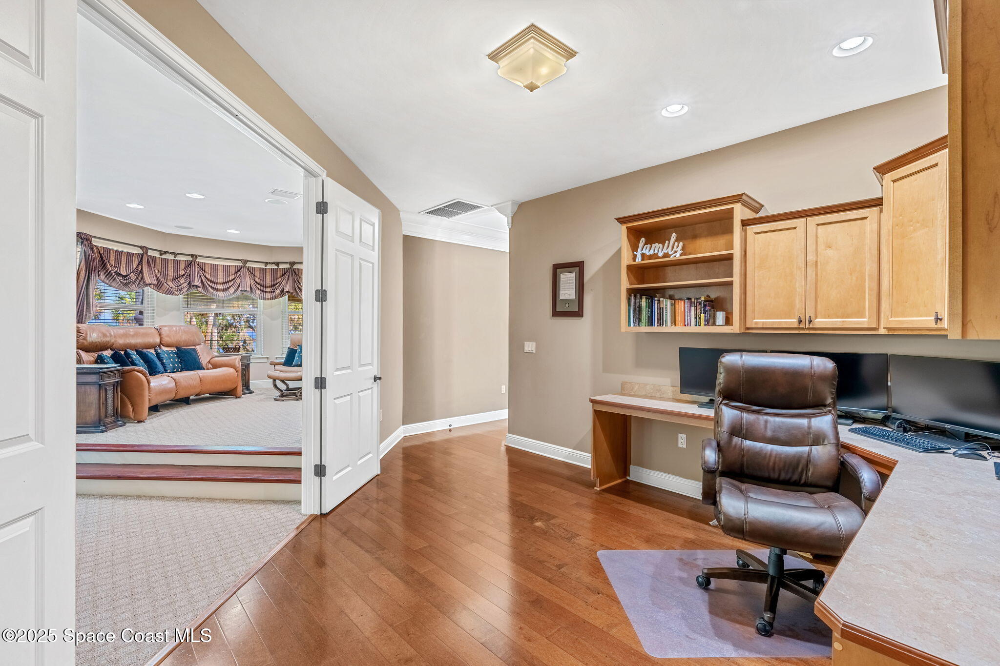 4297 Crooked Mile Road Merritt Island, FL 32952 - Photo 50 of 118 a workspace with furniture cabinet and a window