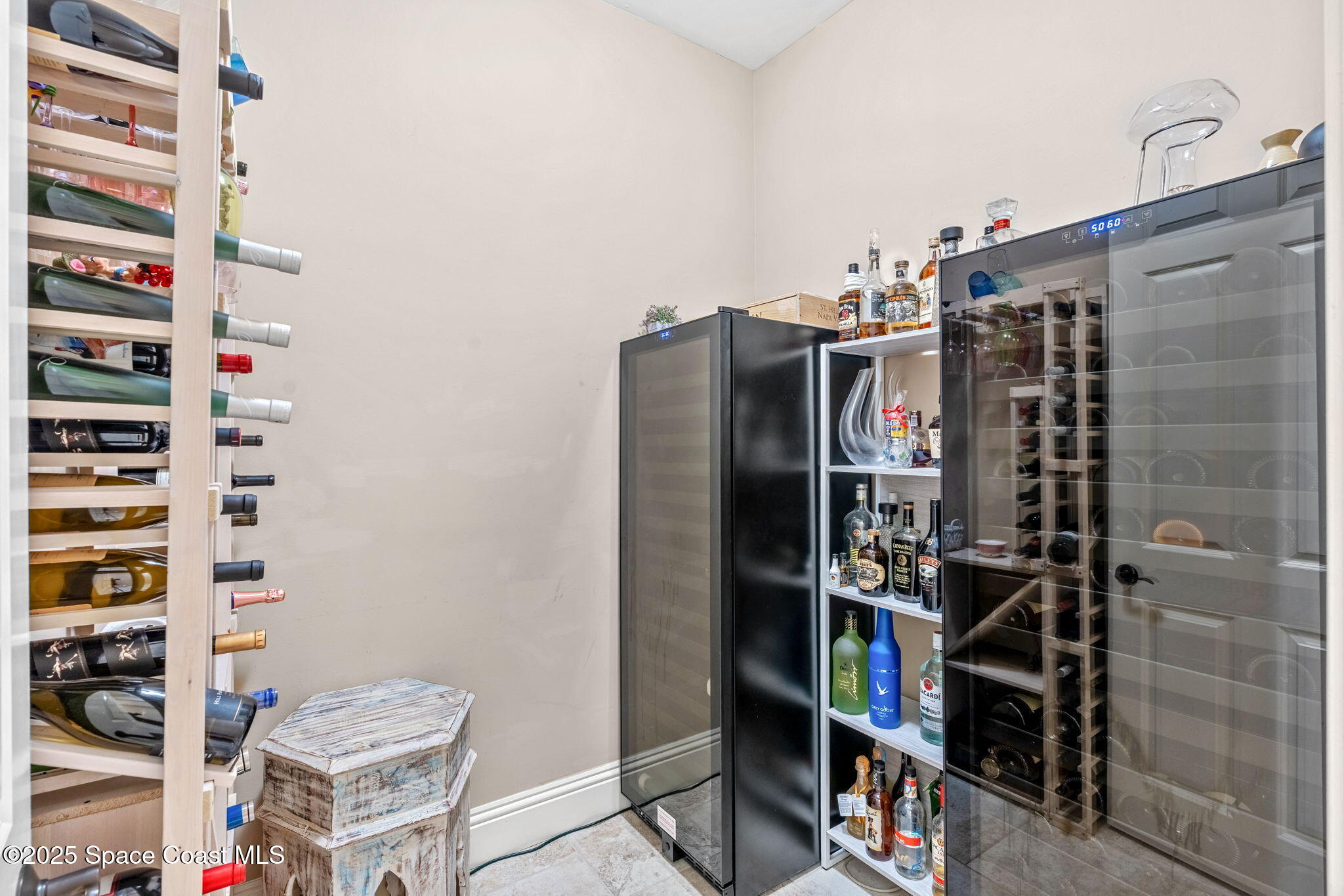 4297 Crooked Mile Road Merritt Island, FL 32952 - Photo 65 of 118 a view of walk in closet with clothes and shoes