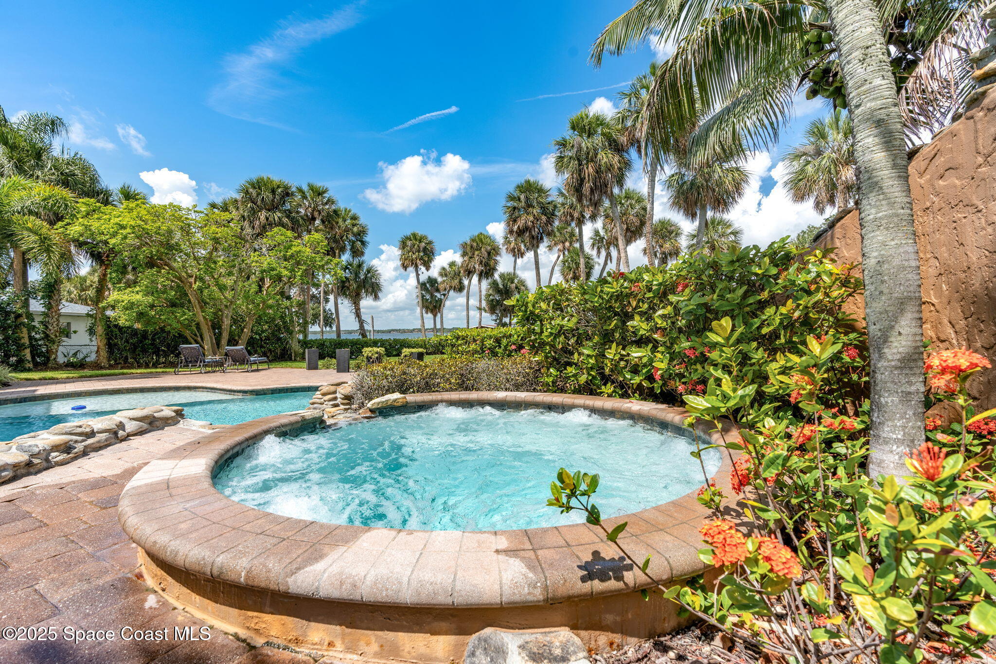 4297 Crooked Mile Road Merritt Island, FL 32952 - Photo 74 of 118 a view of a swimming pool with an outdoor space and seating area