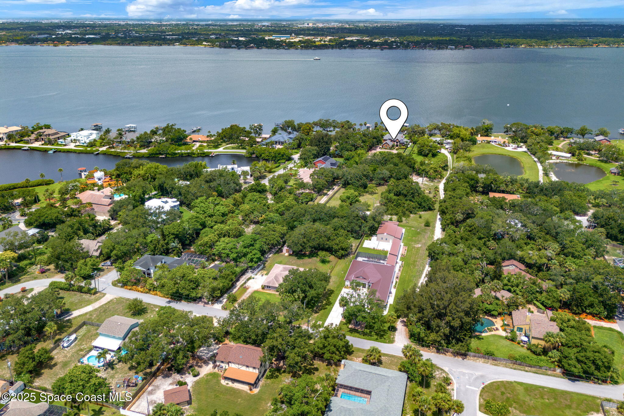 4297 Crooked Mile Road Merritt Island, FL 32952 - Photo 96 of 118 102-web-or-mls-DJI_20250610120645_0037_D