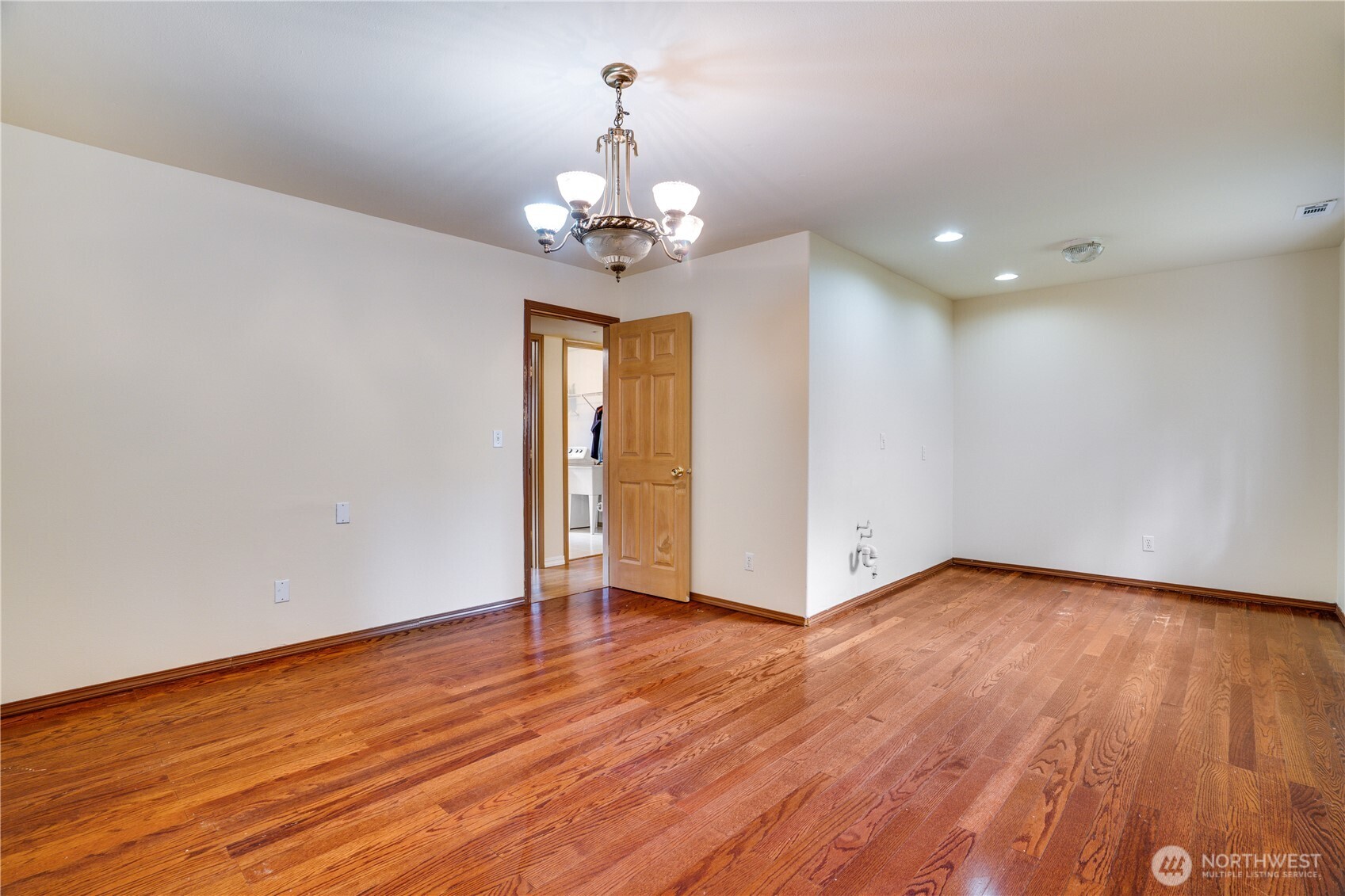 935 Southwest 319th Place Federal Way, WA 98023 - Photo 16 of 26 a view of an empty room with wooden floor and a window
