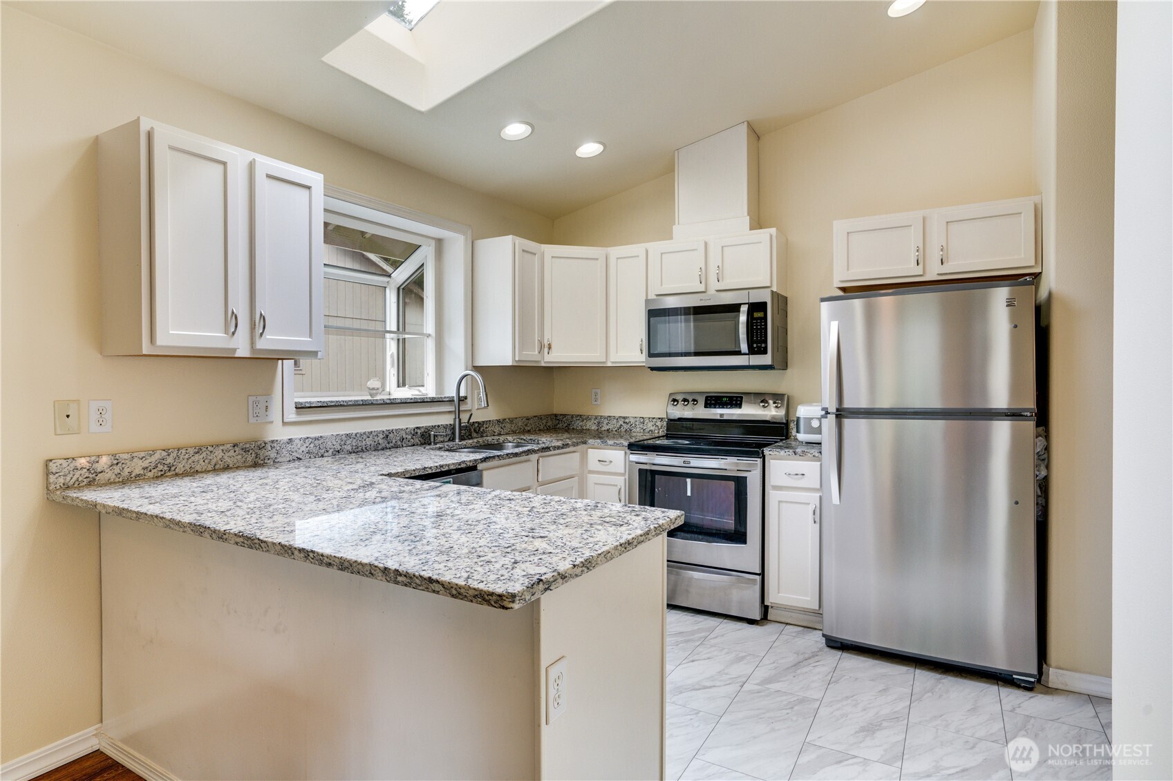 935 Southwest 319th Place Federal Way, WA 98023 - Photo 6 of 26 a kitchen with a refrigerator sink and microwave
