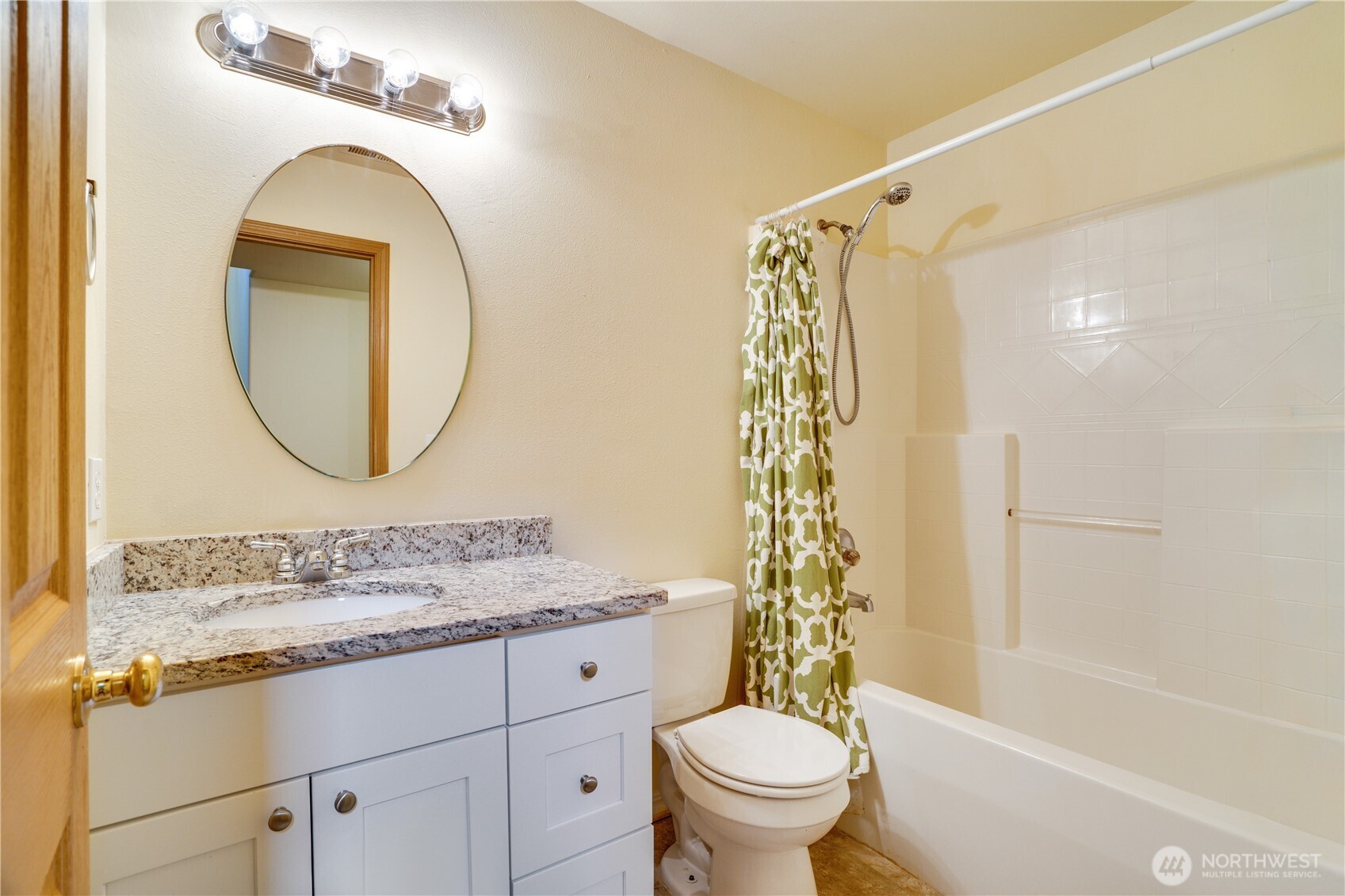 935 Southwest 319th Place Federal Way, WA 98023 - Photo 10 of 26 a bathroom with a sink a mirror a toilet and a bathtub