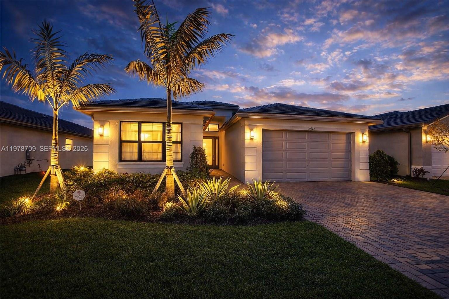 10922 Southwest Meandering Mile Road, Unit 10922 Port St. Lucie, FL 34987 - Photo 2 of 56 a view of a backyard