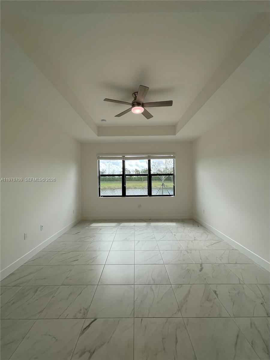 10922 Southwest Meandering Mile Road, Unit 10922 Port St. Lucie, FL 34987 - Photo 29 of 56 a view of an empty room and window
