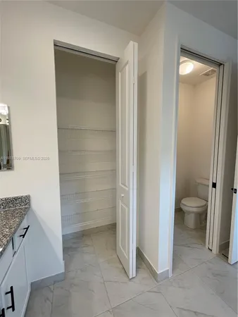 a view of storage and utility room with washer and dryer