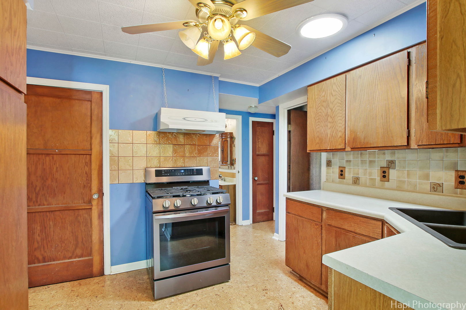 27797 North Forest Garden Road Wauconda, IL 60084 - Photo 12 of 35 a kitchen with stainless steel appliances a stove a sink and a refrigerator