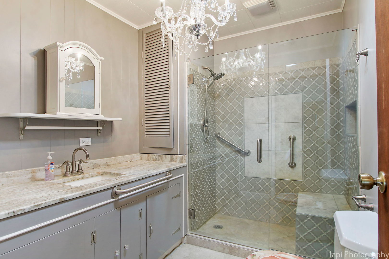 27797 North Forest Garden Road Wauconda, IL 60084 - Photo 21 of 35 a bathroom with a granite countertop sink a mirror and shower
