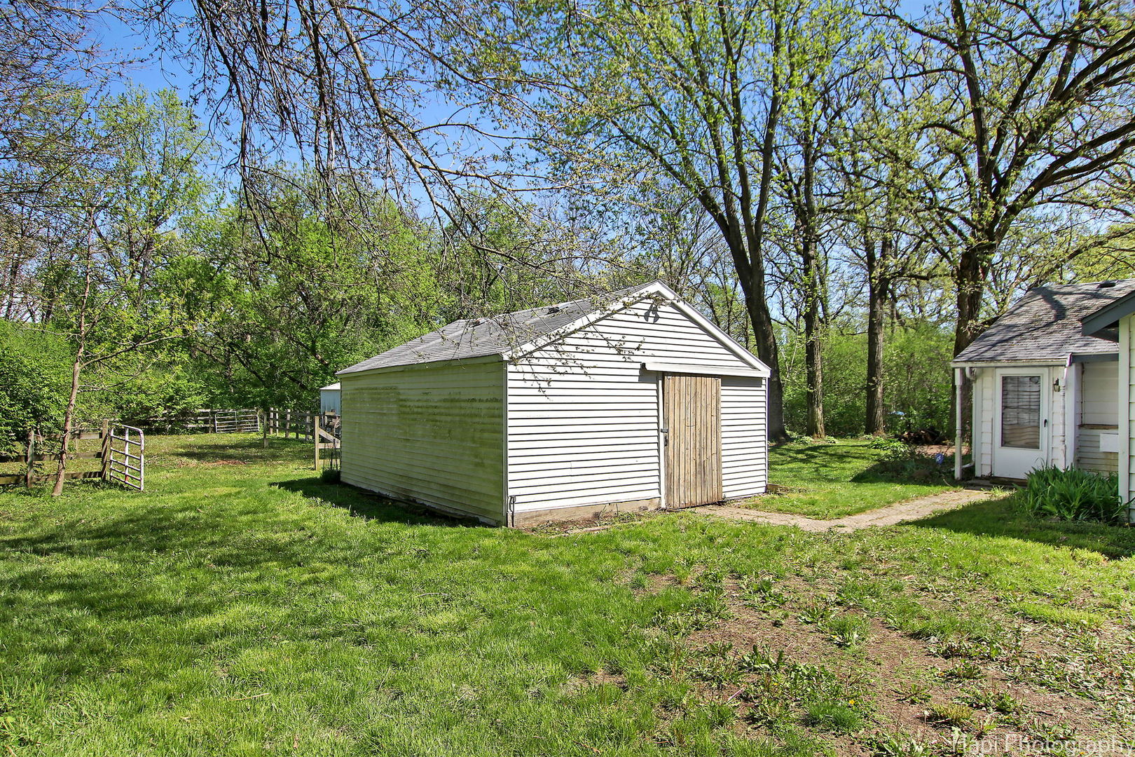 27797 North Forest Garden Road Wauconda, IL 60084 - Photo 25 of 35 a view of a backyard with a small cabin