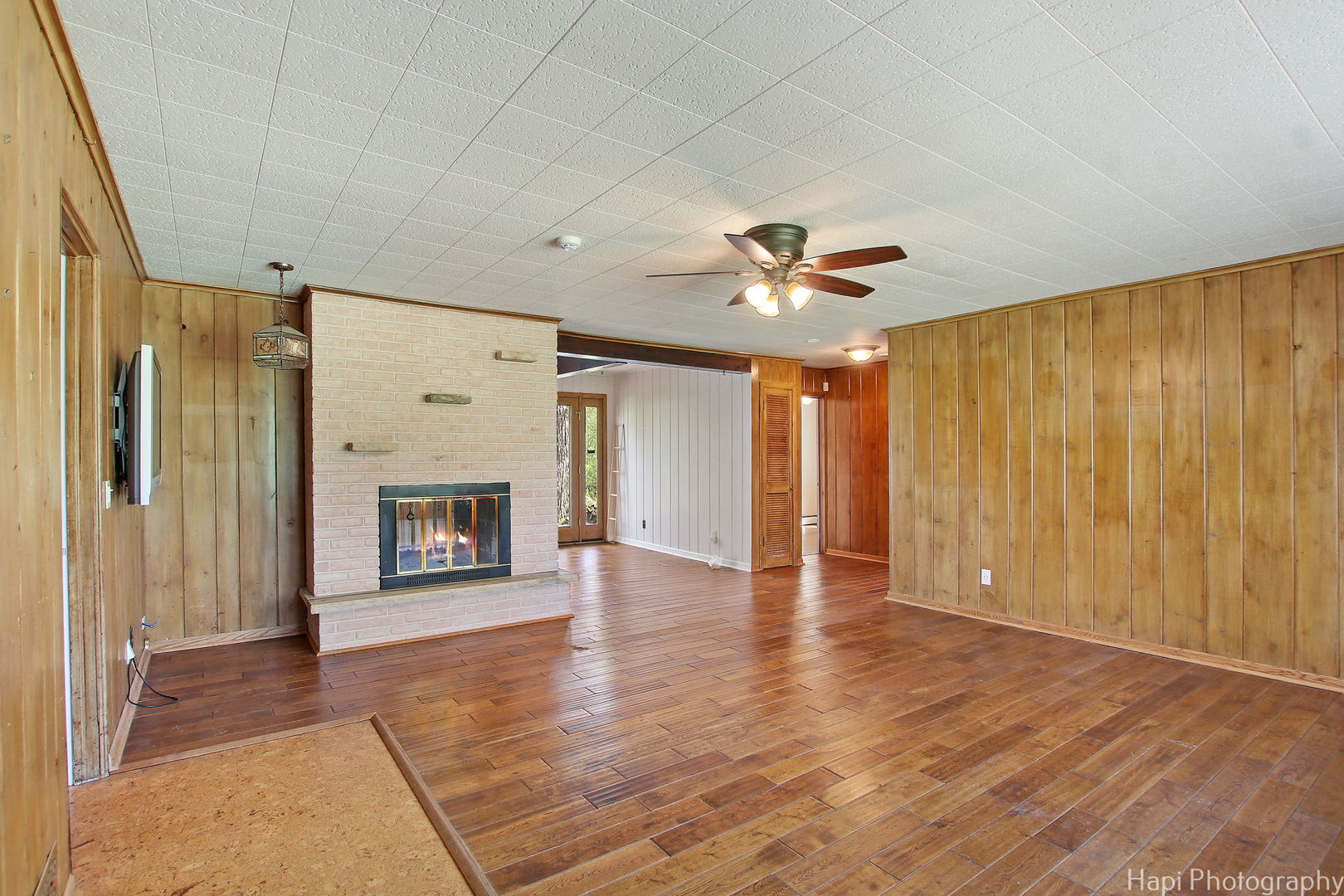 27797 North Forest Garden Road Wauconda, IL 60084 - Photo 6 of 35 a view of an empty room with a fireplace and a window