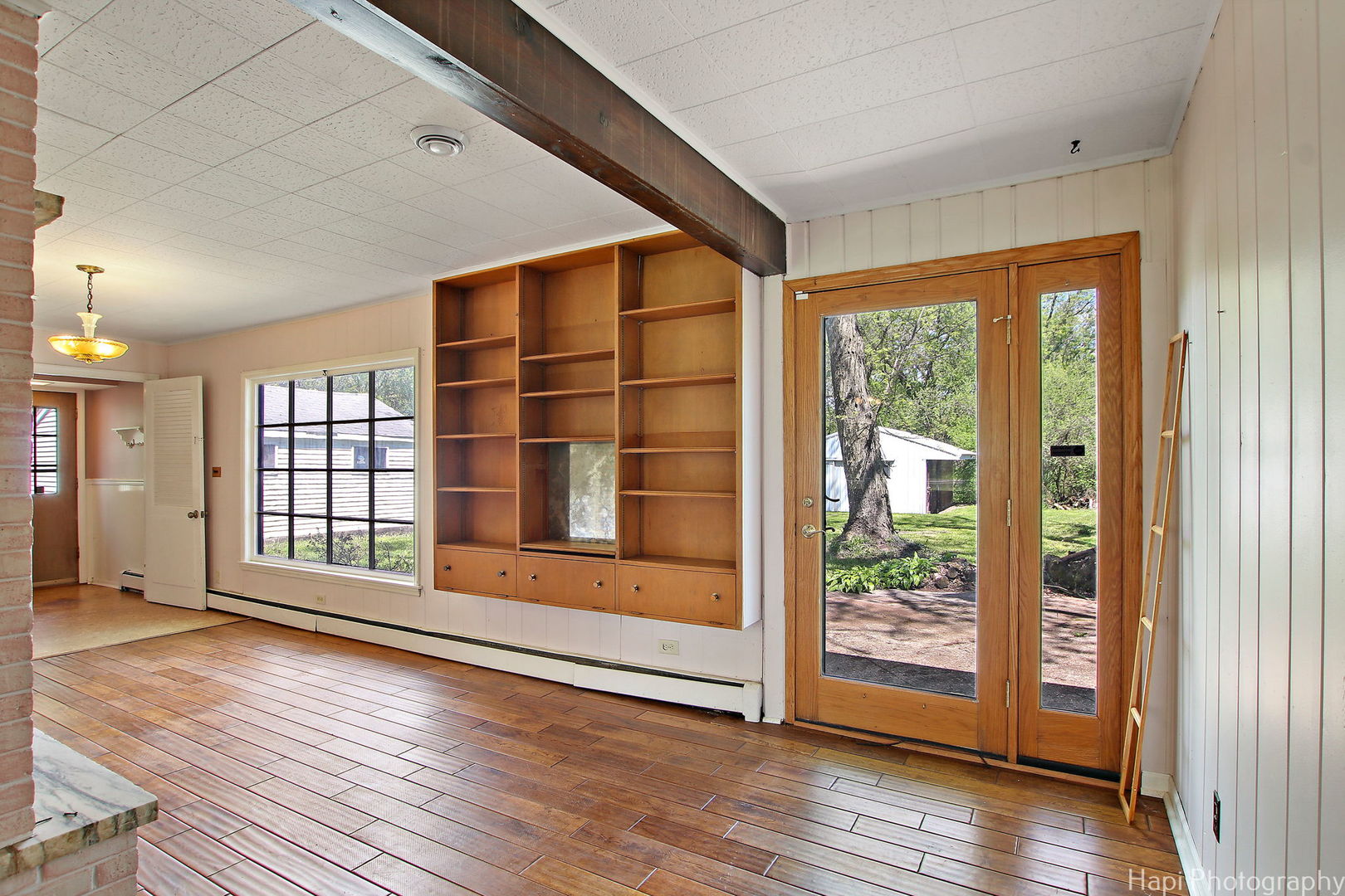 27797 North Forest Garden Road Wauconda, IL 60084 - Photo 8 of 35 a view of an empty room with wooden floor and a window