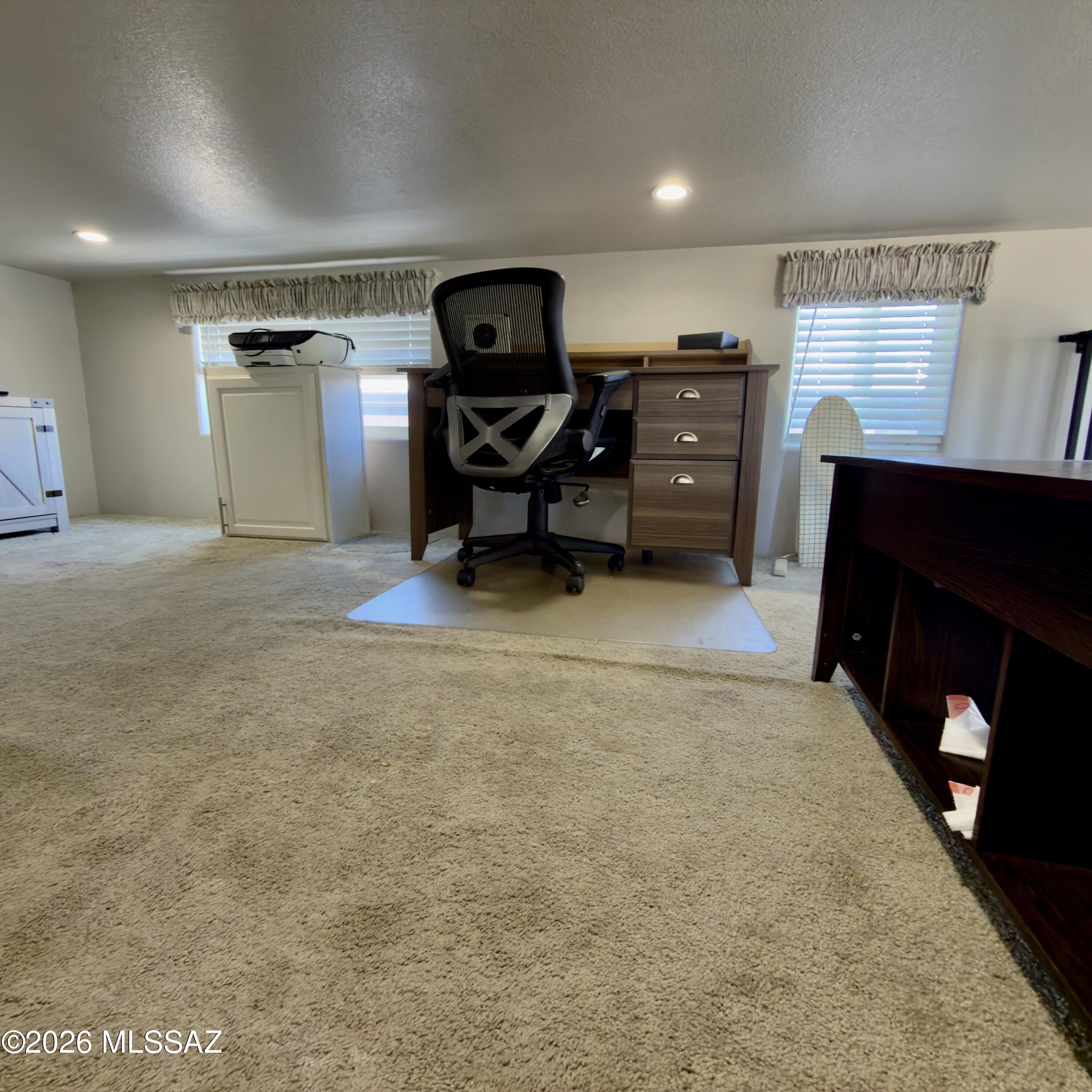 2843 19 Interstate 19 Frontage Road, Unit 116 Amado, AZ 85645 - Photo 23 of 32 a view of a workspace with furniture