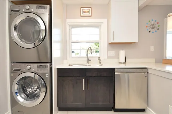 a bathroom with a toilet a sink and shower