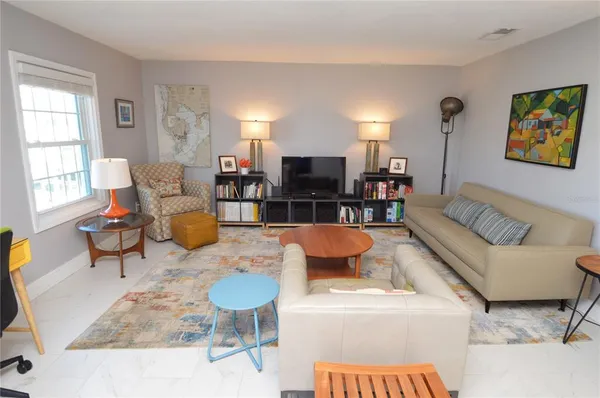 a bathroom with a sink toilet tub and shower