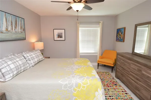 a bedroom with two beds and a flat screen tv