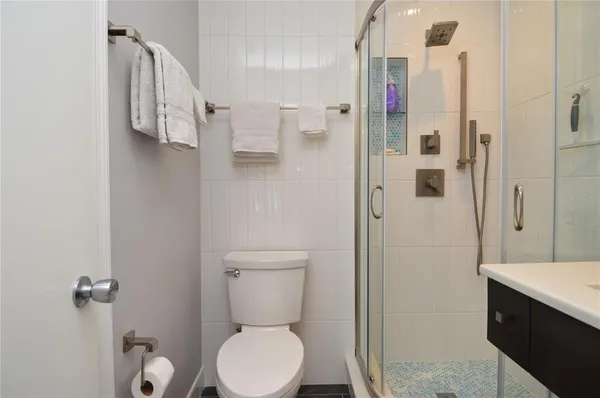 a balcony with wooden floor outdoor seating and outdoor seating