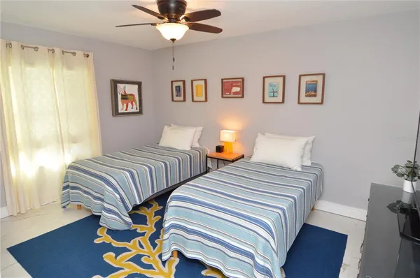 a view of a white house with a yard