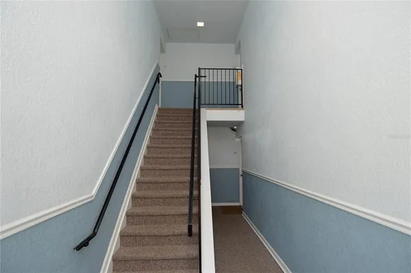 a kitchen with stainless steel appliances a refrigerator stove and microwave