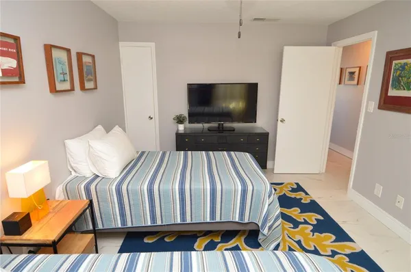 a view of a patio with a table and chairs