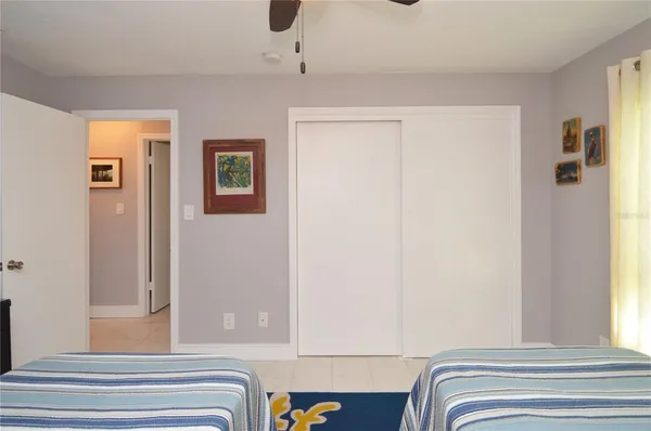 a front view of a house with a garden and fountain