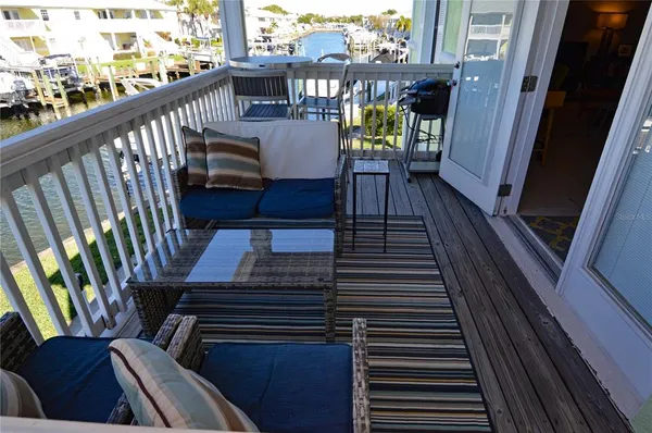an aerial view of residential houses with outdoor space and lake view