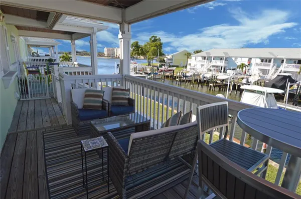 an aerial view of residential houses with outdoor space and swimming pool