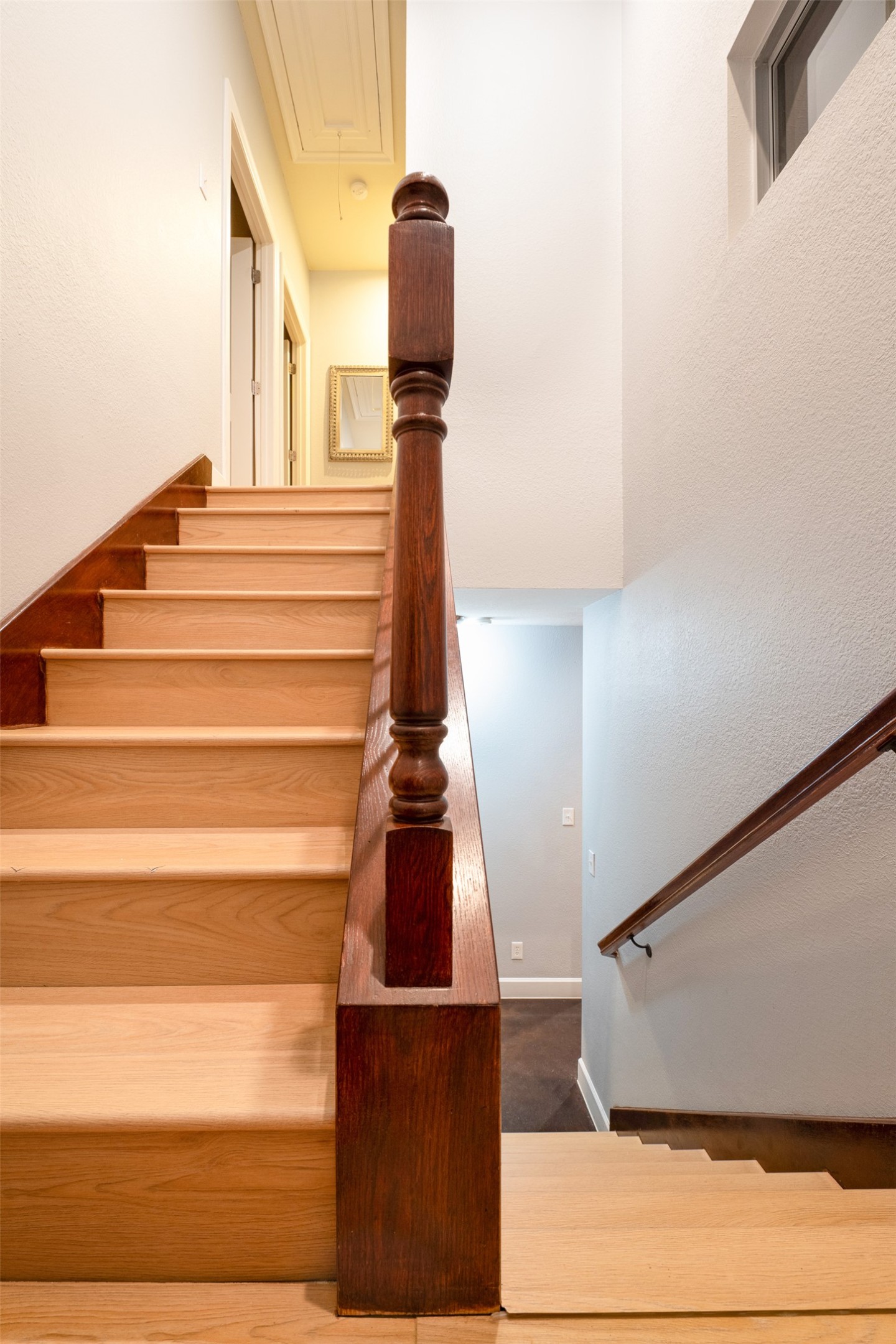 2302 East 9th Street Austin, TX 78702 - Photo 21 of 31 Solid oak stairs with a richly stained banister provide a grand ascent to the upper level.