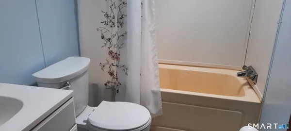 a bathroom with a toilet and a sink
