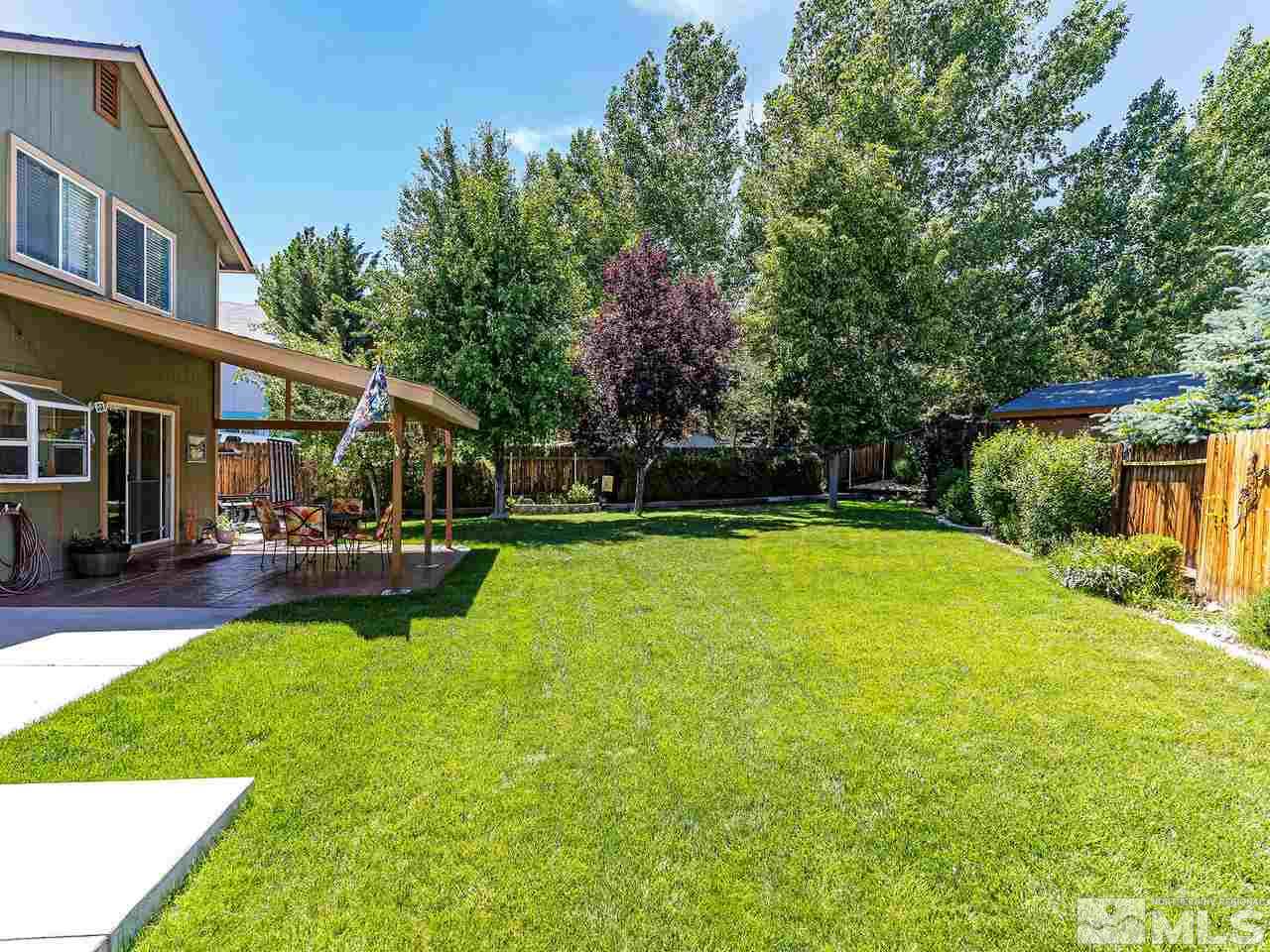 1171 Forest Street Reno, NV 89509 - Photo 4 of 26 a view of a house with swimming pool and a yard
