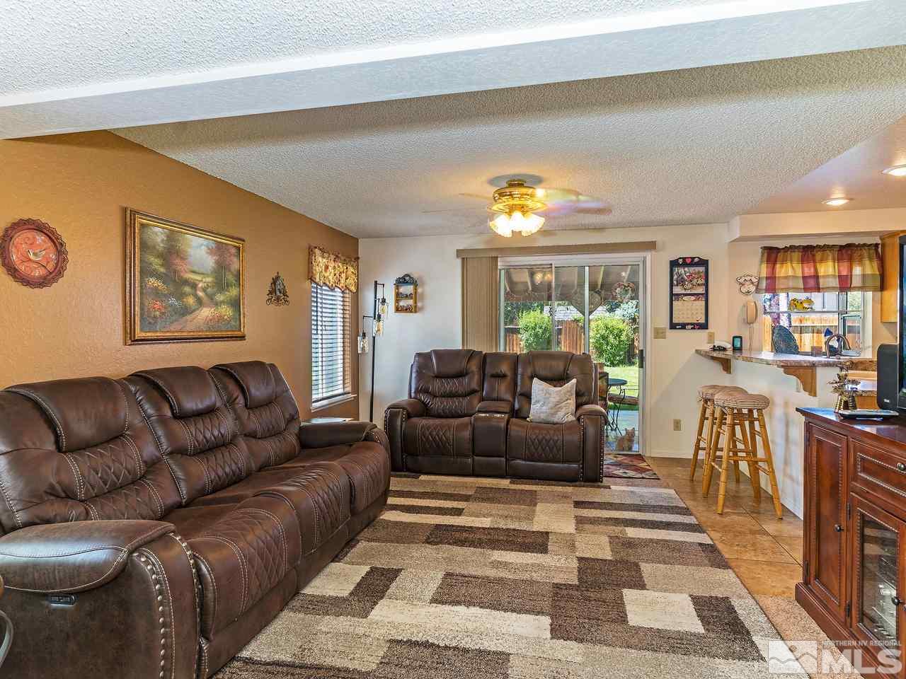 1171 Forest Street Reno, NV 89509 - Photo 8 of 26 a living room with furniture and a large window