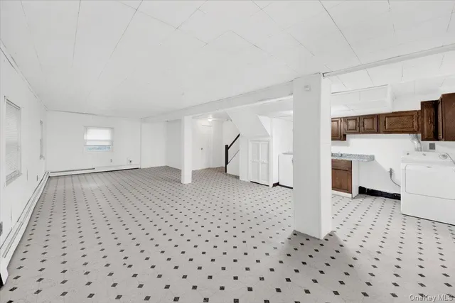 a view of a livingroom with furniture and wooden floor